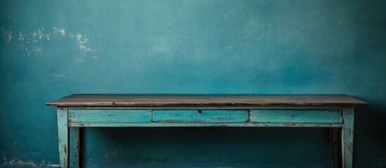 A worn blue-green vintage table