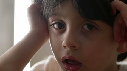Lazy Drowsy Youngster in Deep Thought, Close-Up of Bored Little Boy Pondering. Close-up face of...