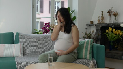 Pregnant woman having ache, 30s lady struggling with nausea during third trimester of pregnancy...