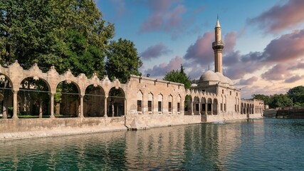 Sanliurfa, Turkey - 14.10.2022: Balikligol fish pond and Halil ur Rahman mosque. This is a sacred site and birth place of prophet abraham - obrazy, fototapety, plakaty