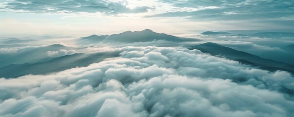 Obraz premium mountain peaks above the clouds.