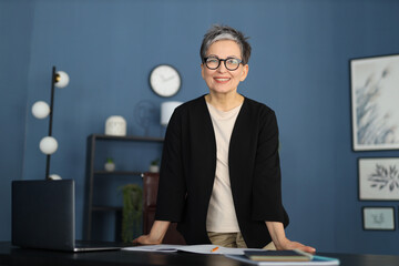 successful, mature entrepreneur radiates happiness and confidence, exuding timeless beauty.