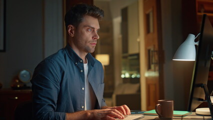 Overworked manager typing computer keyboard desk night having overtime closeup