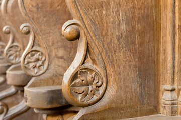Old wood carving in German church, oak wood and traditional processing, church pews
