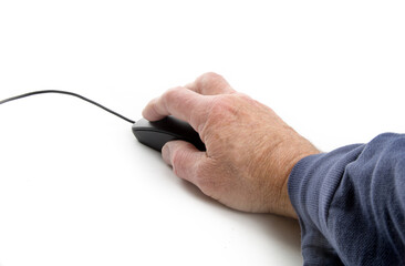 A person's hand operating a computer mouse  isolated on white