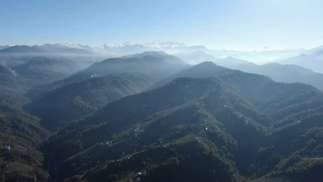 A stunning aerial view of a mountainous landscape shrouded in fog. mountains in trabzon Turkey