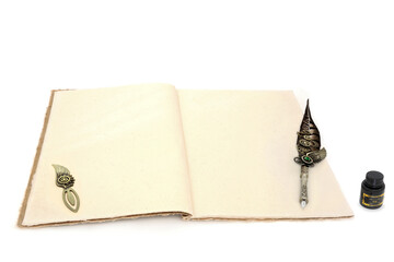 Ancient stationery writing equipment with retro feather quill pen, hemp notebook, opener, ink bottle on white background. Letter, document, journal, manuscript concept.
