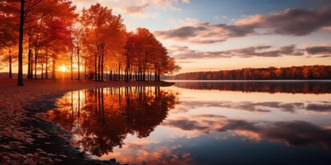 Foto op Canvas a group of trees with orange leaves on the shore of a lake © Xanthius