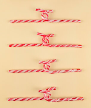Candy lollipops isolated on beige background.