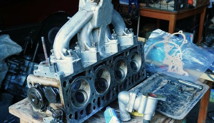Disassembled powerful engine of a car in garage