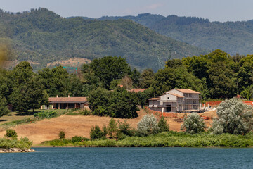 The Bilancino Lake. Lago di Bilancino, Barberino del Mugello, Florence, Italy: landscape at dawn of the picturesque lake in the Tuscan hills