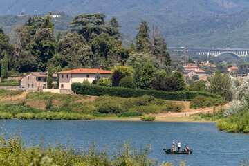 The Bilancino Lake. Lago di Bilancino, Barberino del Mugello, Florence, Italy: landscape at dawn of the picturesque lake in the Tuscan hills