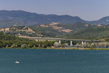 The Bilancino Lake. Lago di Bilancino, Barberino del Mugello, Florence, Italy: landscape at dawn of the picturesque lake in the Tuscan hills