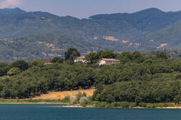 The Bilancino Lake. Lago di Bilancino, Barberino del Mugello, Florence, Italy: landscape at dawn of the picturesque lake in the Tuscan hills