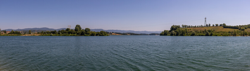 The Bilancino Lake. Lago di Bilancino, Barberino del Mugello, Florence, Italy: landscape at dawn of the picturesque lake in the Tuscan hills