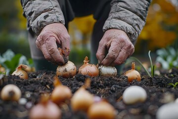 Person planting onions in garden, surrounded by grass and natural foods