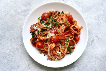Traditional italian pasta with grilled tomatoes, parmesan and garlic. Top view with copy space. - obrazy, fototapety, plakaty