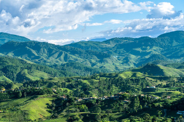 Obraz premium The majestic Andes Mountains around Jerico, Jericó, Antioquia, Colombia. Beautiful evening blue sky with white clouds. picture taken from the Morro el Salvador.