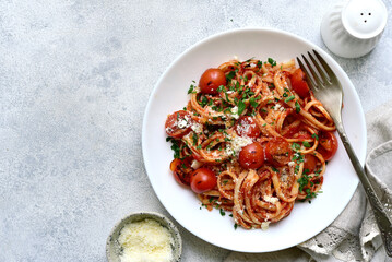 Traditional italian pasta with grilled tomatoes, parmesan and garlic. Top view with copy space. - 782479901