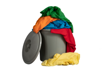 Trashcans, rags, clothes waste sorting, sustainability. Fast fashion is the business concept. Recycled plastic trash bins