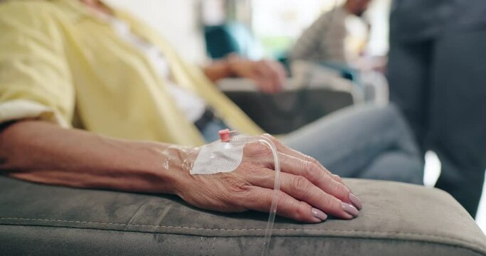 Healthcare, hands and senior woman with needle drip at hospital for cancer, treatment or chemotherapy. Catheter, saline and old patient at wellness clinic IV bar, vitamins or miracle molecule therapy