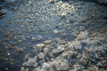 Frozen ground. Ice on the road. Frozen surface.