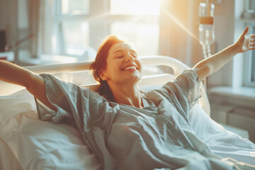 Caucasian cheerful woman patient with arms outstretched on hospital bed celebrating her recovery from surgery