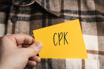 Yellow card with a handwritten inscription 