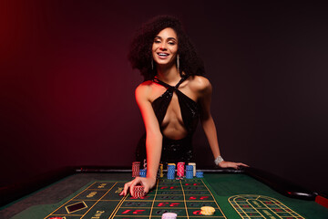 Photo of chic happy girl professional poker shark player feel excited with successful strategy...