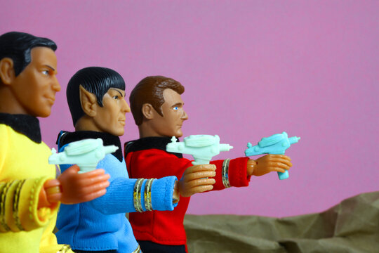 NEW YORK USA, JULY 14 2018: cene from Star Trek The Original Series where Captain Kirk, Mr Spock and Lte Leslie, red shirt security, draw phasers after beaming down to a planet - Mego style figures
