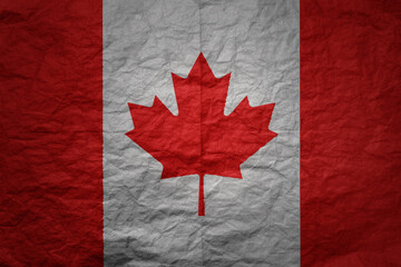 big national flag of canada on a grunge old paper texture background