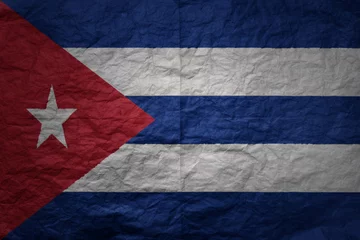 Fototapeten big national flag of cuba on a grunge old paper texture background © luzitanija