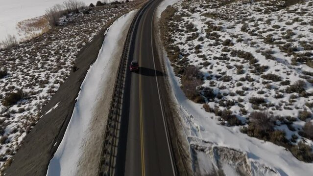 Drone shot of a car driving down a mountain road near Steamboat Springs, Colorado