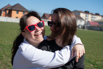 Close up portrait of a two young women in sunglasses	