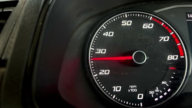 Video of car tachometer needle indicating RPMs