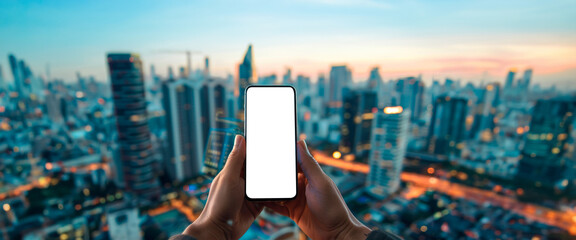 Hand holding smartphone with blank screen, cityscape during sunrise in the background. Mockup of a cell phone with transparent. Advertising and marketing. Banner. Copy space - Powered by Adobe
