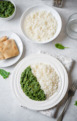 Spinach dahl with rice in a plate - 782518105
