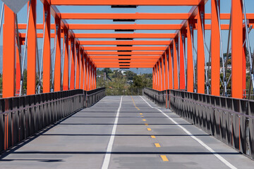 View of the Frogtown bike path bridge crossing the Los Angeles River between Elysian Valley and Cypress Park in Los Angeles, California.