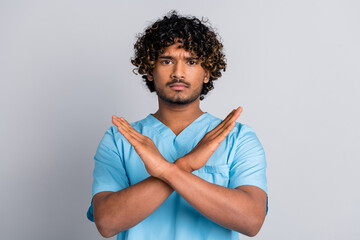 Photo of serious guy doctor cross hands prevent virus isolated grey color background