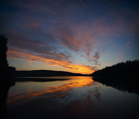 Amazing Dramatic sunset over the lake.