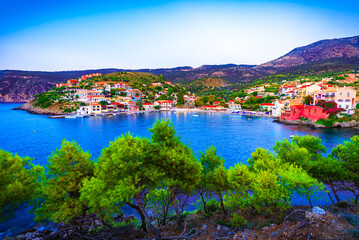 Assos, Kefalonia, Greece. Colorful houses and turquoise colored bay of a village on an idyllic Ionian island - 782532758