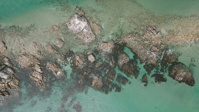Top-down aerial view on a rocky shore in New Zealand
