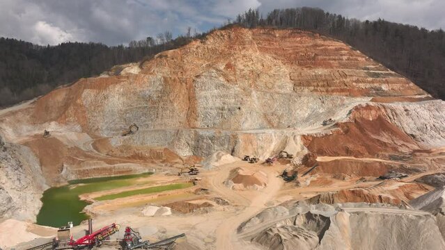 Aerial shot - Drone flying closer to an open pit quarry somewhere in Slovenia, Europe