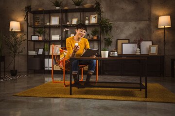 Naklejka premium Japanese mature woman read recipe for medicament use tablet at home