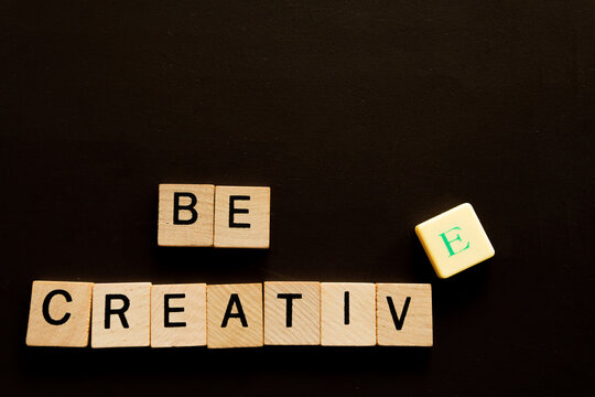 A Wooden Block With The Word Be Creative - Written On It.
