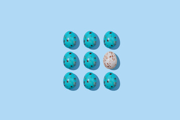 Pattern of beautiful blue chicken eggs for Easter on  blue background, top view