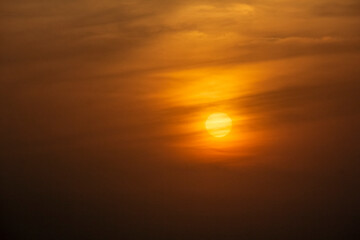 Picturesque view of the sunset on a semi cloudy sky indicating heat and warmth