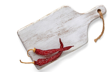 White wooden cutting board and two dried capsicums isolated on a white background. Top view with copy space
