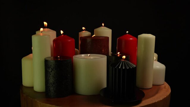 Burning candles in the dark room. Dark gothic Halloween concept. Witch cult ritual mystery background.