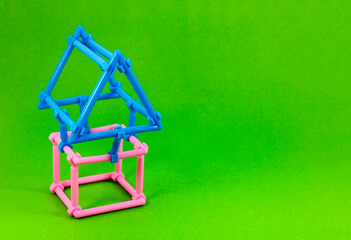 Plastic pieces that form a house shaped structure